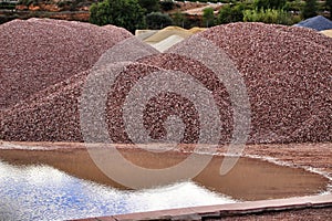 Colorful construction aggregate mountains in Alicante, Spain.