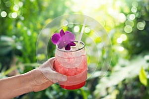 Colorful cool drink in summer on nature background