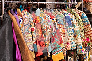 Colorful costumes for sale in front of the fashion boutique