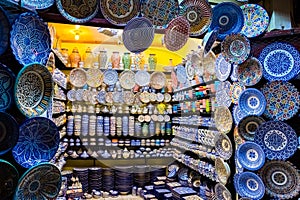 Colorful crafts shop with ceramic art on a traditional moroccan market in medina of Fez, Morocco, Africa