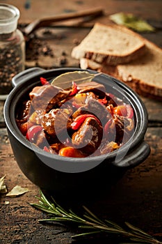 Colorful crock of Hungarian beef goulash photo