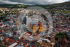 Colorful crowd american city buildings in hill, Guanajuato, Mexico
