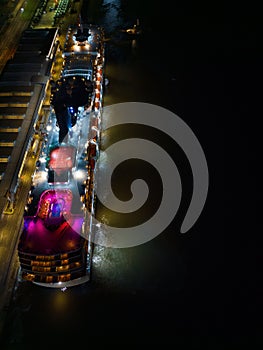 Colorful cruise ship lights on a deck at night Southampton UK aerial