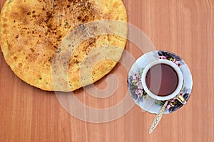 Colorful cup of tea on a saucer