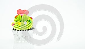 Colorful cupcakes with beautiful decoration over white background