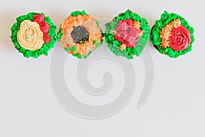 Colorful cupcakes on white background