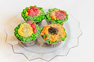 Colorful cupcakes on white background