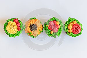 Colorful cupcakes on white background