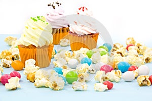 Colorful cupcakes on a wooden background