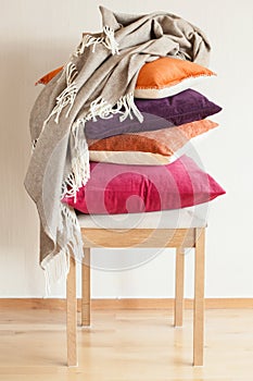 Colorful cushions on chair cozy home mood