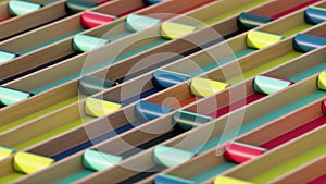 Colorful cylinders roll along lanes 3d looping animation. Conceptual abstract modern loop, geometric moving blocks