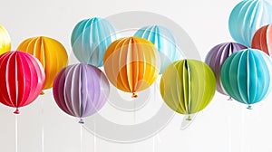 Colorful 3D paper balloons in a range of hues, floating with a sense of lightness and celebration photo