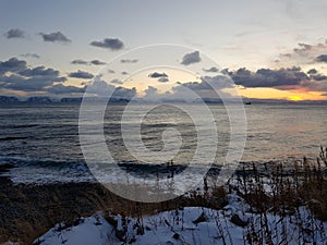 Colorful dawn sky over arctic circle fjord view in nordkapp county