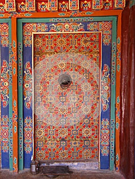 Colorful decorated closed door at Drepung monastery, Lhasa, Tibet, China