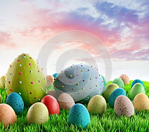 Colorful decorated eggs in the grass