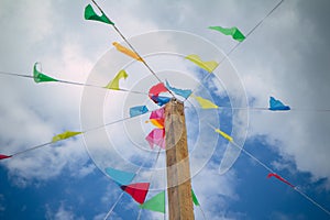 Colorful decoration flags against blue sky background on a summer festival happy and joyful playing kids, games. summer blue .