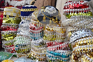 Colorful decorative headgear on exposed at the Erbil Bazaar in Kurdish Iraq