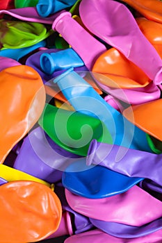 Colorful deflated balloons on the desk