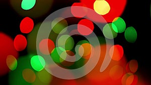 Colorful defocused blinking bokeh festive lights as abstract background