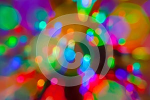 Colorful defocused bokeh lights in blur night background