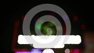 Colorful defocused flickering night Lights abstract background. Beautiful bright blured bokeh. City nightlife