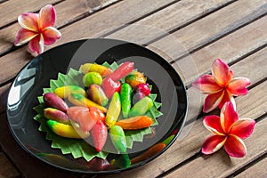 Colorful deletable imitation fruits on table