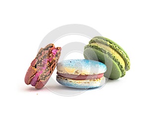Colorful and delicious French macaroon and pieces isolated on white