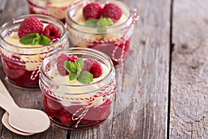 Colorful and delisious dessert in a jar berry cramble