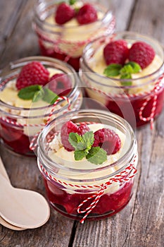 Colorful and delisious dessert in a jar berry cramble