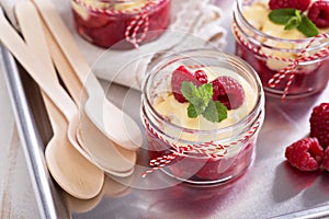 Colorful and delisious dessert in a jar berry cramble