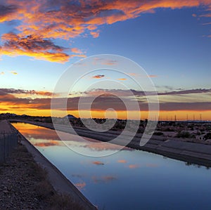 Colorful Desert Sunrise Mirror Refection On Water