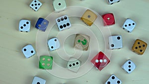 Colorful dices on wooden background. turntable anticlockwise
