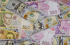 Colorful of different banknotes Ukrainian national currency bills and American dollars money and finances investment concept