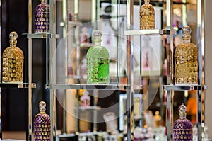 Colorful different perfume bottles displayed at fragrance store