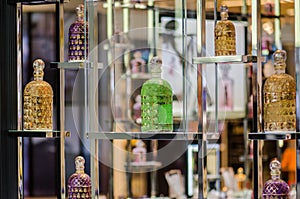 Colorful different perfume bottles displayed at fragrance store