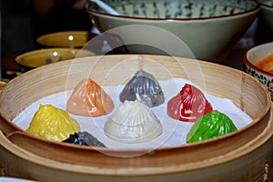 Colorful dim sum in bamboo steamer, chinese cuisine