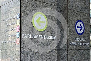 Colorful direction signs on a wall in the European Parliament in Brussels, Belgium