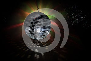 Colorful disco mirror ball lights night club background. Party lights disco ball. Selective focus