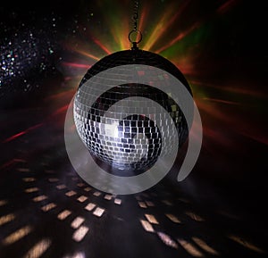 Colorful disco mirror ball lights night club background. Party lights disco ball. Selective focus