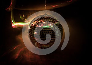 Colorful disco mirror ball lights night club background. Party lights disco ball. Selective focus