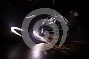 Colorful disco mirror ball lights night club background. Party lights disco ball. Selective focus