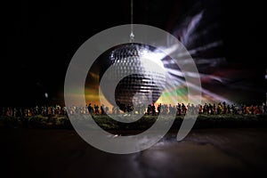 Colorful disco mirror ball lights night club background. Party lights disco ball. Selective focus