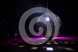 Colorful disco mirror ball lights night club background. Party lights disco ball. Selective focus