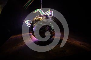 Colorful disco mirror ball lights night club background. Party lights disco ball. Selective focus