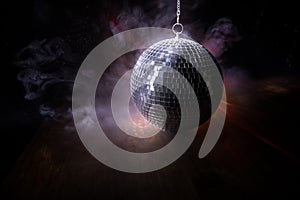 Colorful disco mirror ball lights night club background. Party lights disco ball. Selective focus