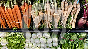 Colorful display of organic vegetables on the shelf in the supermarket