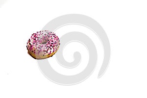 Colorful donut isolated on white. Sweet icing sugar food with glazed sprinkles, doughnut with frosting. Top view with copy space