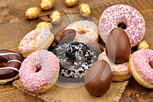 Colorful donuts with milk chocolate Easter eggs photo