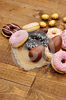 Colorful donuts with milk chocolate Easter eggs photo