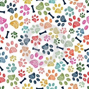 Colorful doodle paw prints and bone seamless pattern for textile design